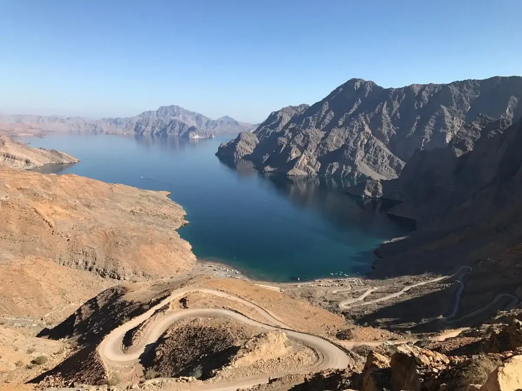 A fjord at Khor Najd with a road winding down to the water, Musandam