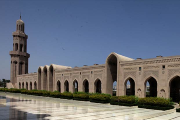 Arcades and a minaret around the courtyard of the Sultan Qaboos Grand Mosque