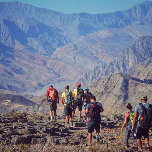 Hikers on a mountain path in Musandam