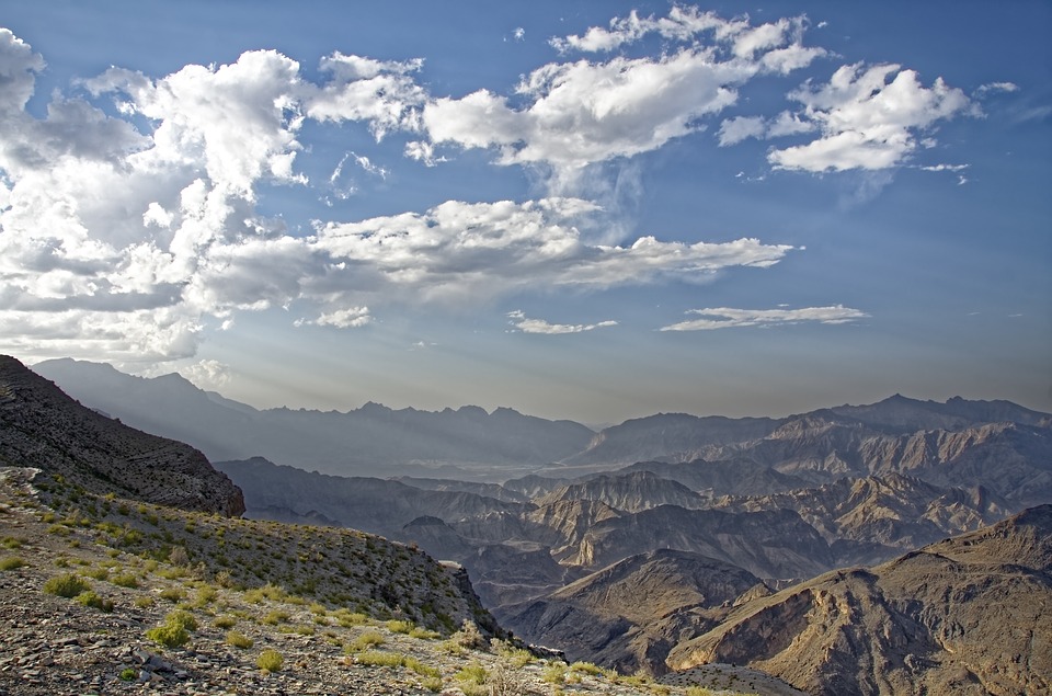 View over mountain ridges and valleys under a cloudy sky